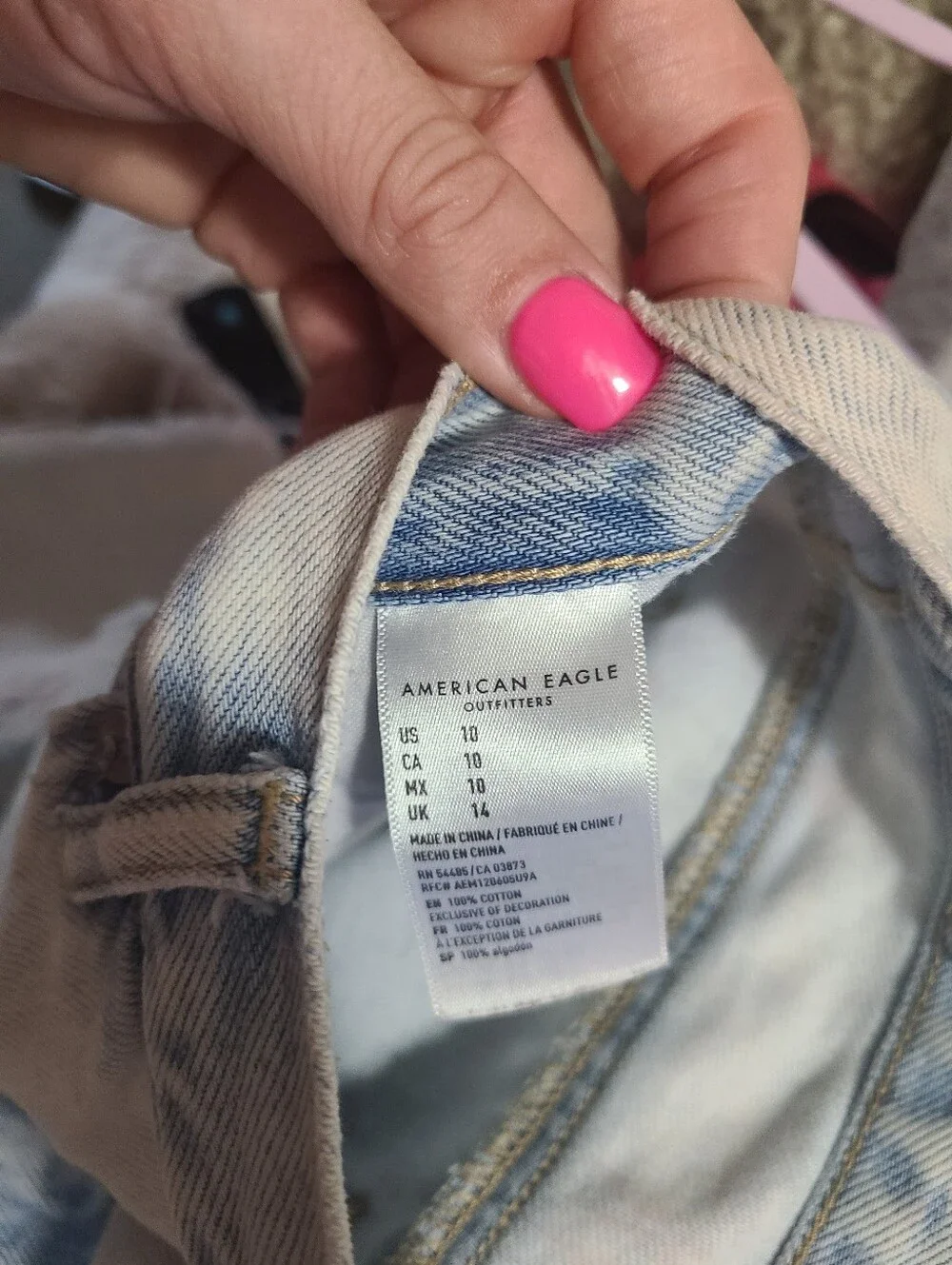 American Eagle Ripped Denim Baggy Mom Shorts in a light wash.